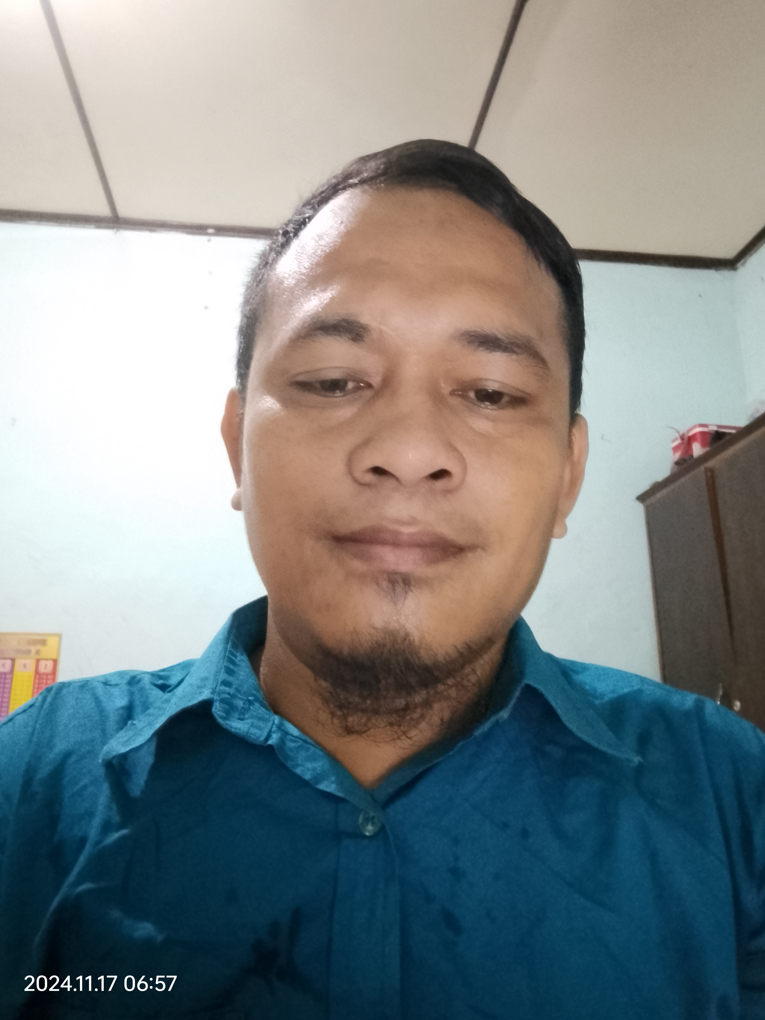 Foto Mauris pandapotan Sinaga s.pd